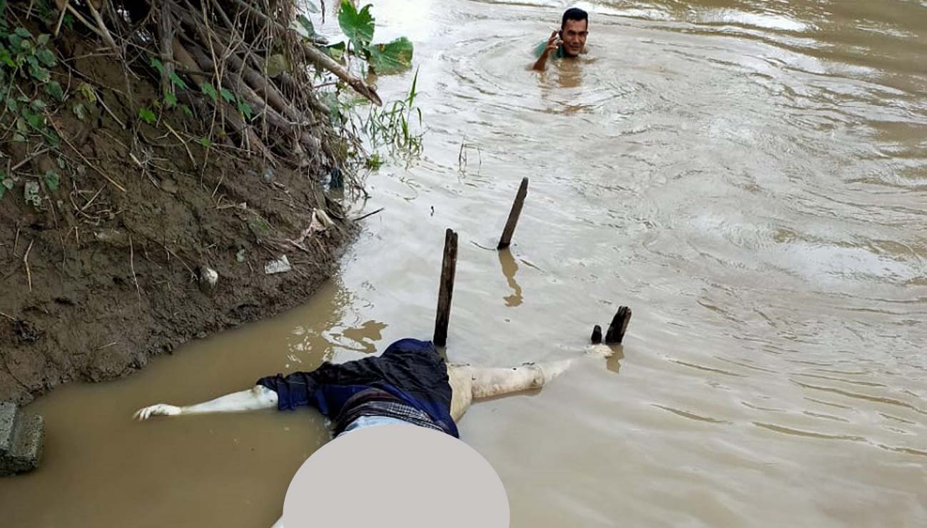 mayat mengambang di Sungai Belawan Sesosok mayat mengambang di Sungai Belawan.