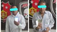 judi togel di asahan AWH dan AP, dua tersangka judi togel setelah diamankan di Mapolres Asahan, Selasa (28/3/2023). (foto: istimewa)