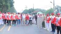 gerak jalan asahan Bupati Asahan H. Surya melepas peserta gerak jalan dalam rangka memeriahkan Hari Ulang Tahun (HUT) ke 78 Republik Indonesia (RI) di lokasi Car Free Day, Minggu (14/08/2022). (Dok Diskominfo Asahan)