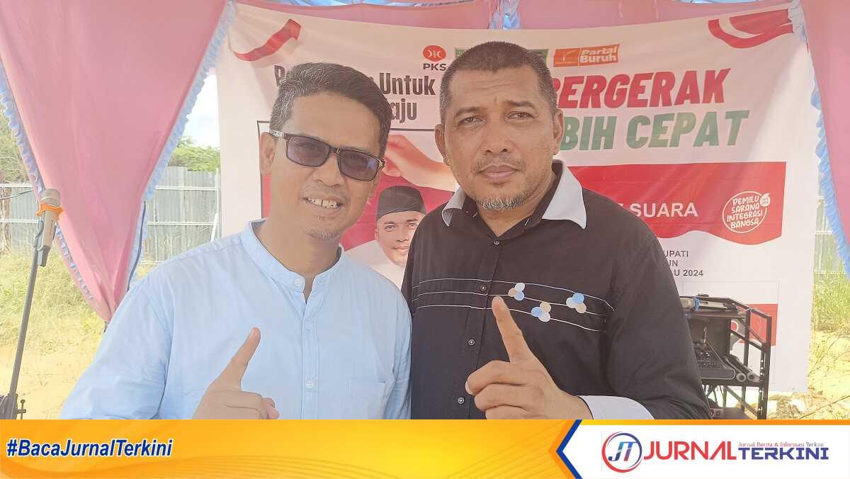 Calon Bupati dan Wakil Bupati Karimun nomor urut 1, Iskandarsyah-Rocky Marciano Bawole berpose di acara silaturahmi dan kampanye bersama Kerukunan Keluarga Besar (KKB) Meranti Kabupaten Karimun di lapangan depan Sekretariat KKB Meranti, Jalan Poros, Karimun, Minggu (13/10/2024). (JurnalTerkini.id/edy kencana)