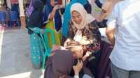 Dinas Kesehatan Indragiri Hilir (Inhil) menggelar imunisasi untuk kesehatan anak beberapa waktu lalu. (JurnalTerkini.id/abdullah)