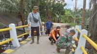 IMG-20250306-WA0017 Foto anggota Koramil 10/Plg melaksanakan pengerjaan sasaran fisik TMMD ke- 123 di desa Mumpa kecamatan Tempuling, kabupaten Indragiri Hilir)